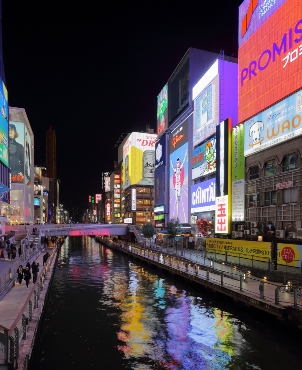Dotonbori canal-side at night with neon signs